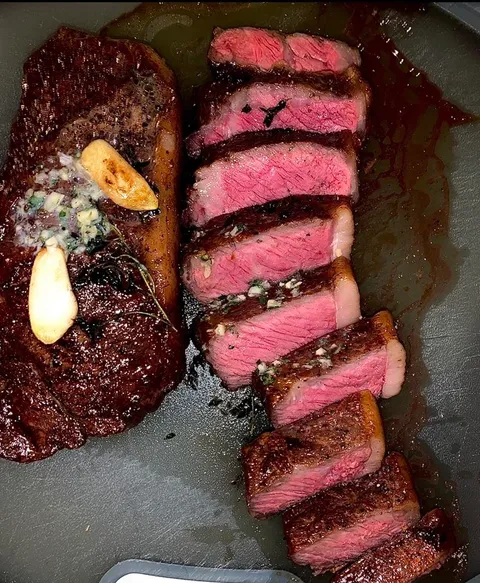 Perfectly cooked NY strip steak.