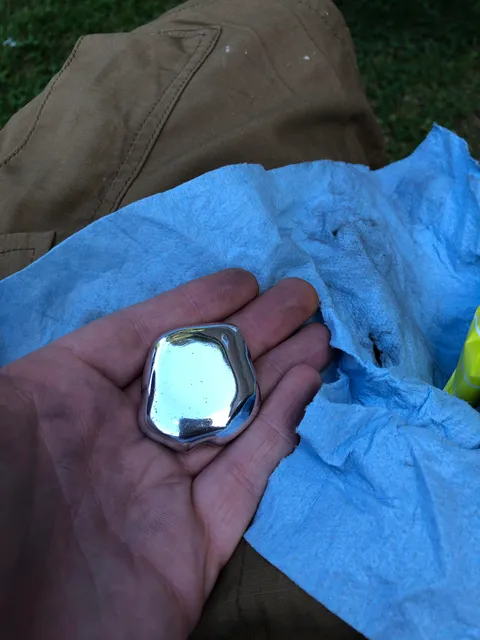 Melted some beer cans and made a shiny rock.