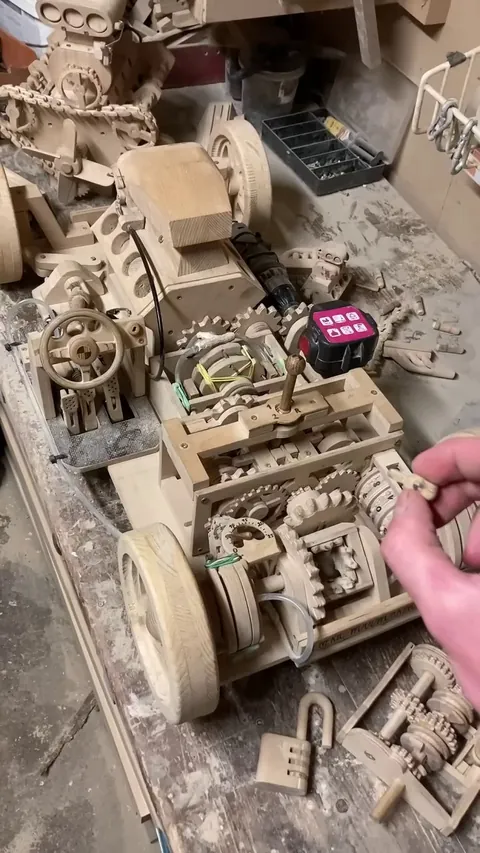 The sheer mechanical genius required to build a fully operational wooden transmission and piston engine