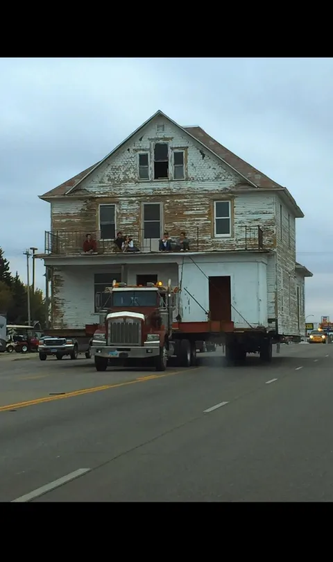 House being moved with people still on it