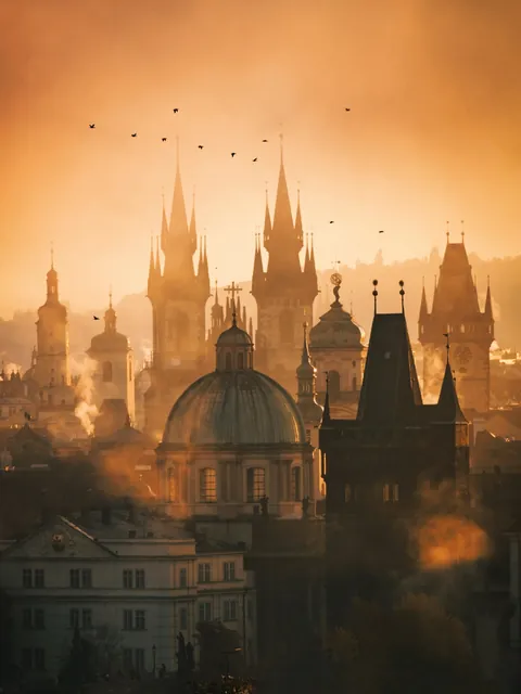 Spires of the 14th-century Church of Our Lady before Týn towering over the skyline of the Old Town of Prague in the morning, Czech Republic.