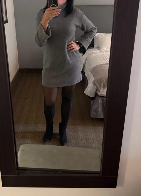 Fully covered up in a cute sweater dress, but it really belongs on the floor.