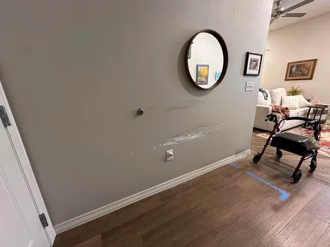 Mom’s new electric wheelchair is destroying the wall. How can I reinforce this area?