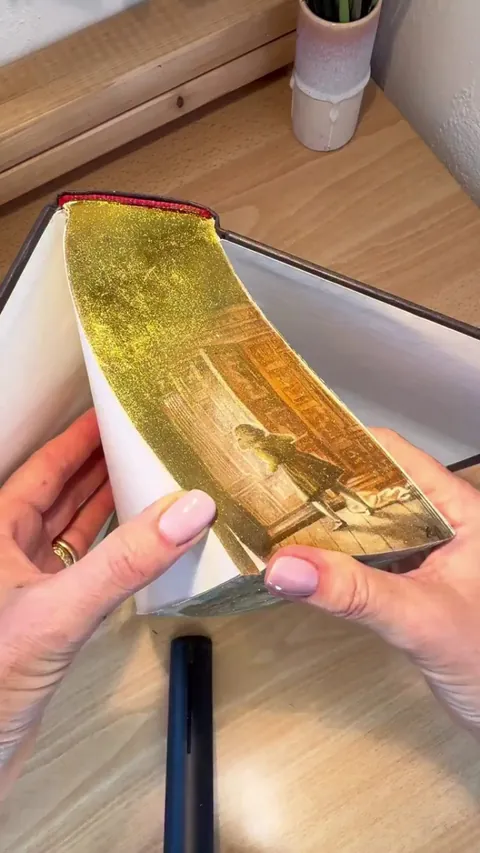 Art work on edges of the book "The chronicles of Narnia"