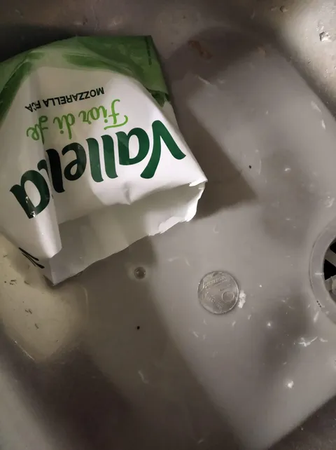 My grandmother found a 10 lire coin (old Italian currency before Euro) in her sealed mozzarella packet