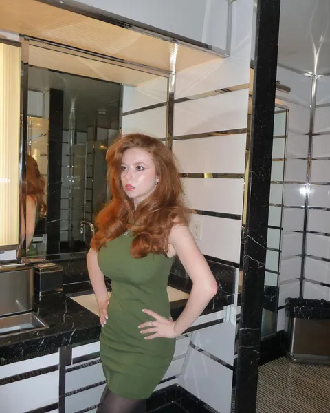 Redhead in a green dress