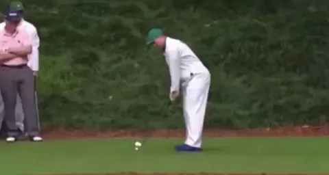 A caddy hits a hole in one infront of Golf Legends