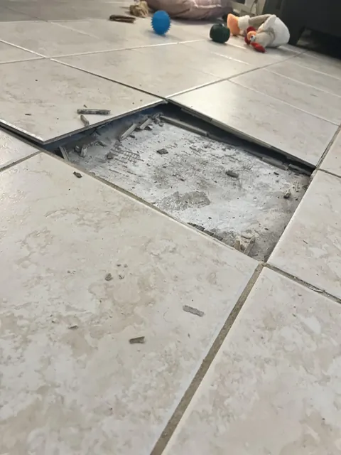 Our tile floor spontaneously buckled today because of a leak in our foundation