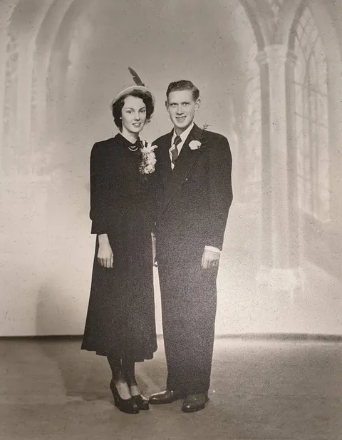 My grandparents wedding photo from the 1940s. Poor farmers they couldn't afford a real wedding dress, so grandma wore her best sunday dress which happened to be navy blue.
