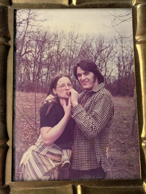 My dad holding a joint for my mom, middle of no where Illinois - mid 1970s