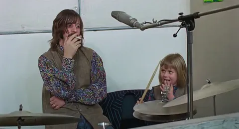 When Paul McCartney married Linda in 1969, he also adopted her daughter Heather. Here's Heather and Ringo playing drums together