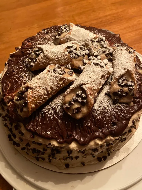 My mother and I always send one another pics of what we make in our kitchens. She won 2019 with this Cannoli Cake