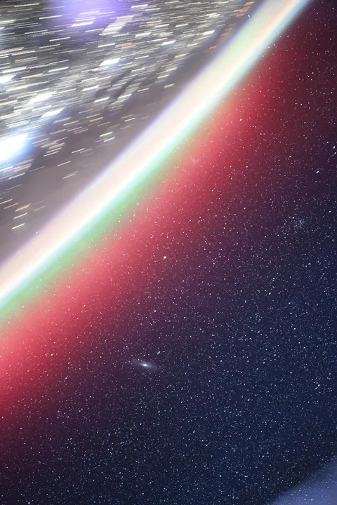 Auroras above Andromeda. By Don Pettit