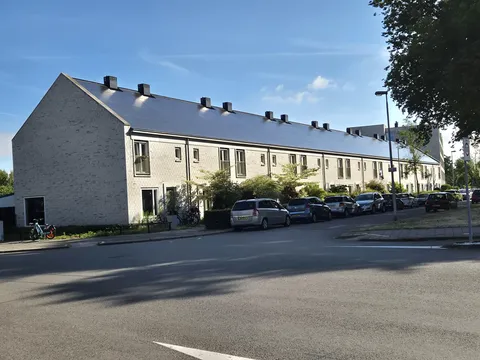These Dutch row houses have one continuous solar paneled roof.