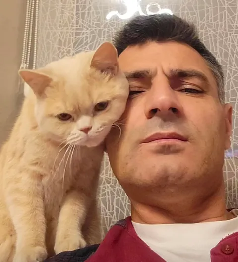 Olympic Shooter &amp; Silver Medalist Yusuf Dikeç with his Cat
