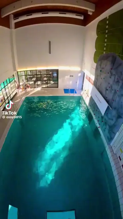 The way the water opens up for a brief moment then closes around him