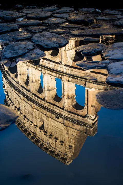 ITAP of the reflection of the Colosseum in Rome