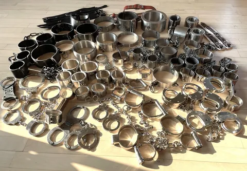 A little handcuff pics ... and a picture of my little collection of metal restraints (only used for selfbondage - I just ... like to choices)