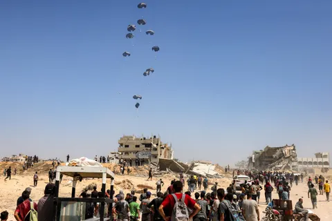(OC) A military transport aircraft drops humanitarian aid on the northern Gaza Strip