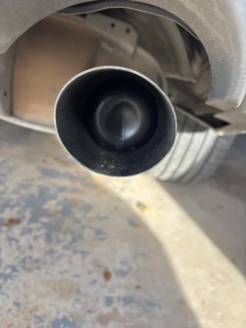 Two year old put a t-ball tube down car exhaust.