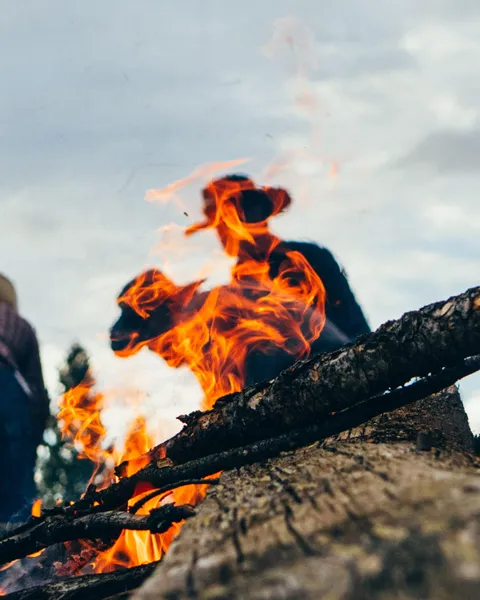 ITAP of cowboys behind a campfire