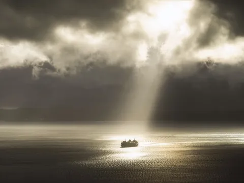 Puget Sound ferry passes through a perfectly formed crepuscular ray column (OC)