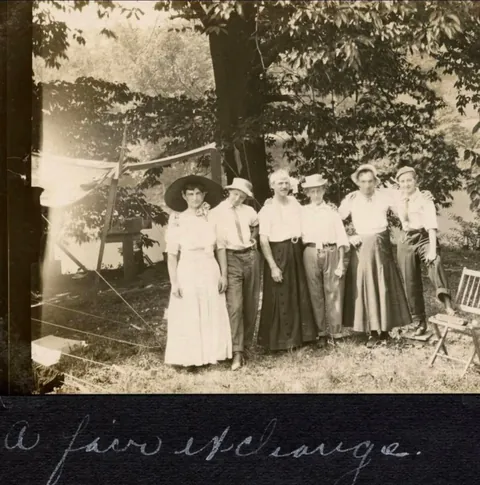 A group of Men and Women goofing around and switching clothes C 1910.