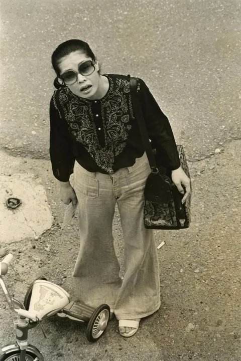 In 1974, Masahisa Fukase photographed his wife, Yōko Wanibe, every morning from the window of their apartment in Tokyo as she left for work.