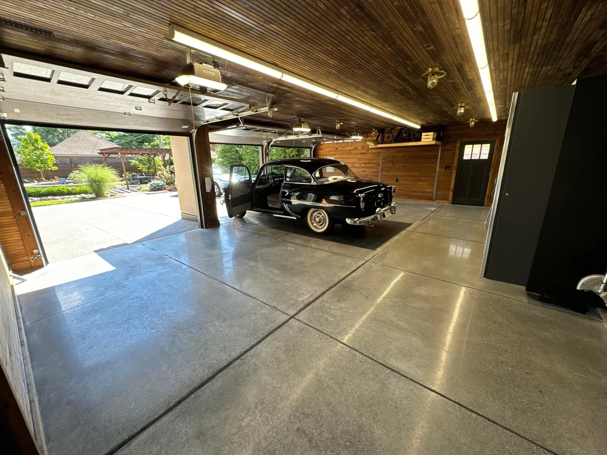 Just had the time to Spring Clean and since we finally finished the concrete floors and got cabinetry installed, I wanted to share! Here is our new, 1920s-styled garage in Detroit with a custom attic elevator, our architectural drawings and images of the original 1927 garage we replaced.