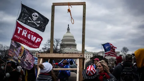 January 6, 2021: Insurrectionists standing around gallows build to hang Mike Pence. 