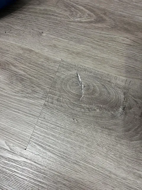 My laminate floor has printed scratches on it (the floor is smooth)