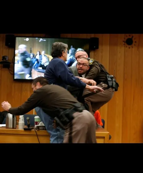 After hearing how Larry Nassar abused hundreds of young athletes, a father of three victims tried to attack him in court, shouting that he wanted “five minutes alone".