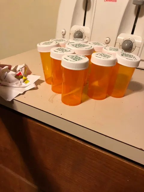 To remove strong adhesive labels from plastic containers, simply leave the containers in the freezer for a few hours first. The stickers will peel off with ease!