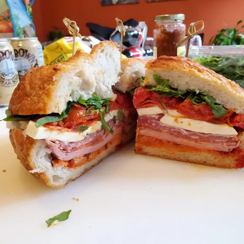 [Homemade] Italian sandwich with capicola, soppressata, mortadella, prosciutto, pecorino primo, fresh mozzarella, roasted tomatoes, olive spread, arugula.