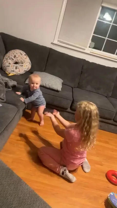 First steps, straight to big sister