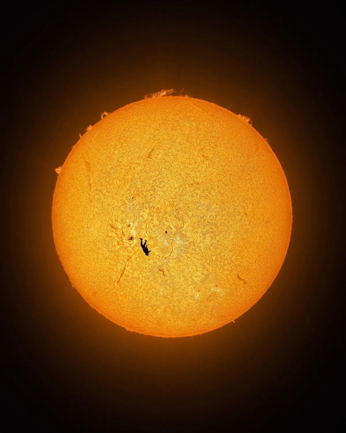 [OC] I captured a photo of my friend in freefall in front of the sun. More details in the comments.