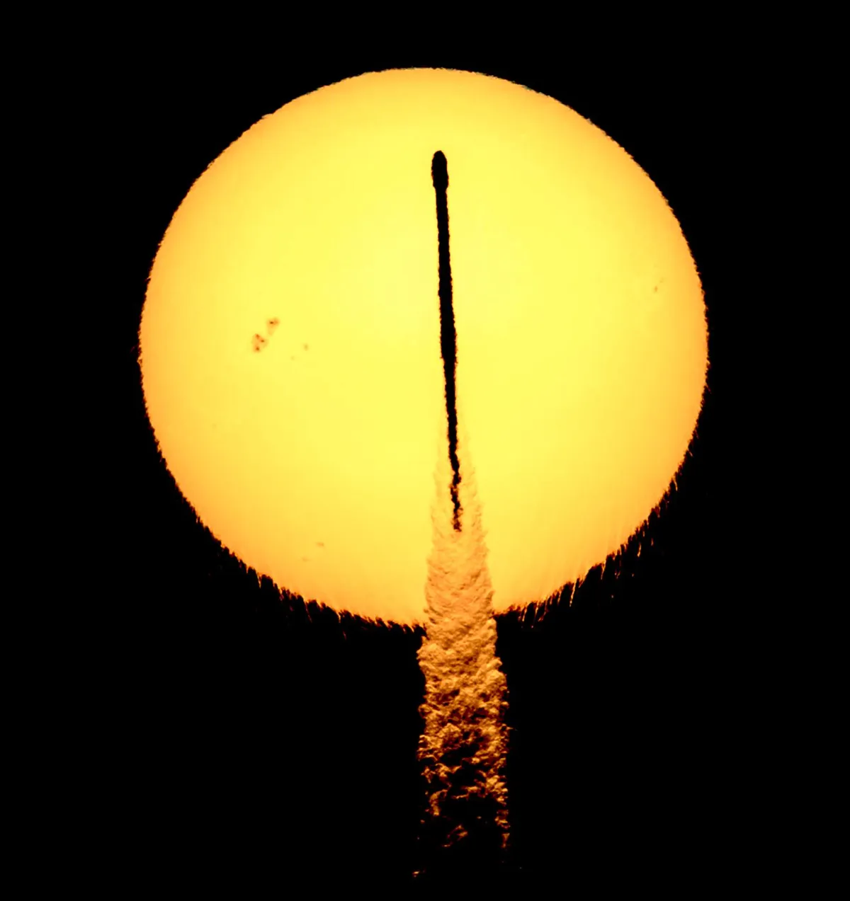 Rocket transits a Flaring Sun
