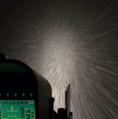 Helicopter pilot flying through a snowstorm