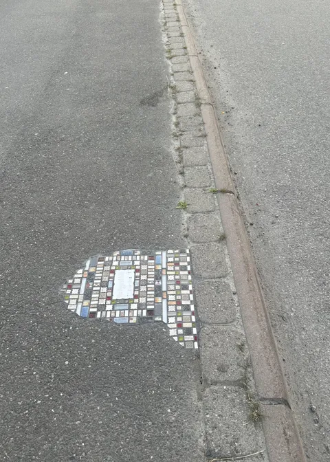 My city has recently been filling small potholes with tiles like