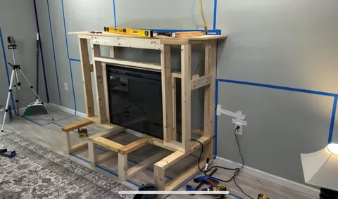 I built a fireplace, cabinets and floating shelves