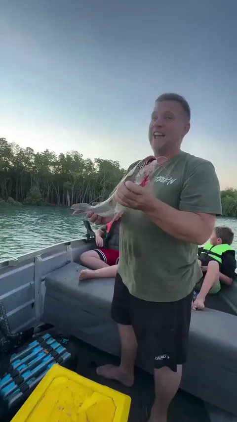 This man makes a perfect throw to a bird and provides it dinner.