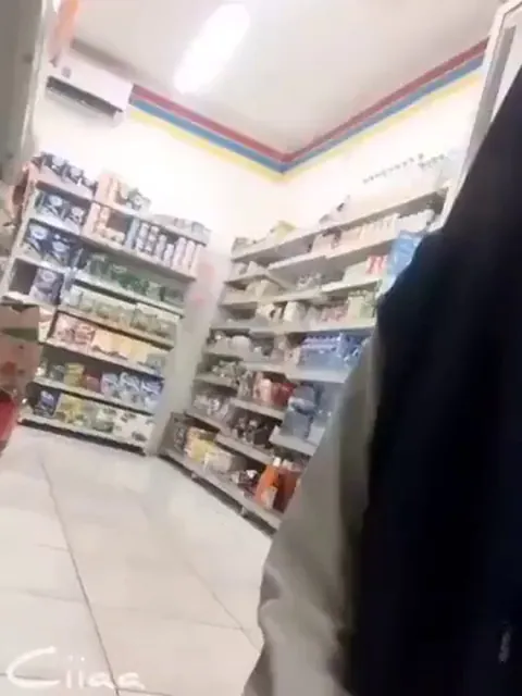 Muslim girl does a riski surprise flashing at the store