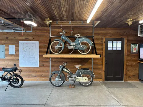 Just had the time to Spring Clean and since we finally finished the concrete floors and got cabinetry installed, I wanted to share! Here is our new, 1920s-styled garage in Detroit with a custom attic elevator, our architectural drawings and images of the original 1927 garage we replaced.