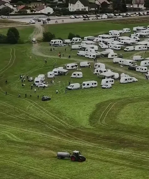 Farmers use tractors to spray manure on squatters to remove them from their land, reportedly after receiving no help from the police