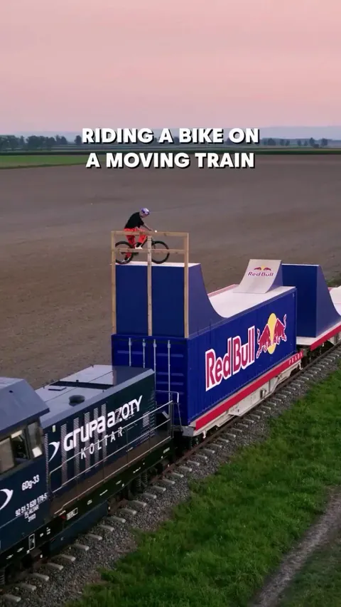 Dawid Godziek becomes the first ever rider to complete a mountain bike course on a moving train