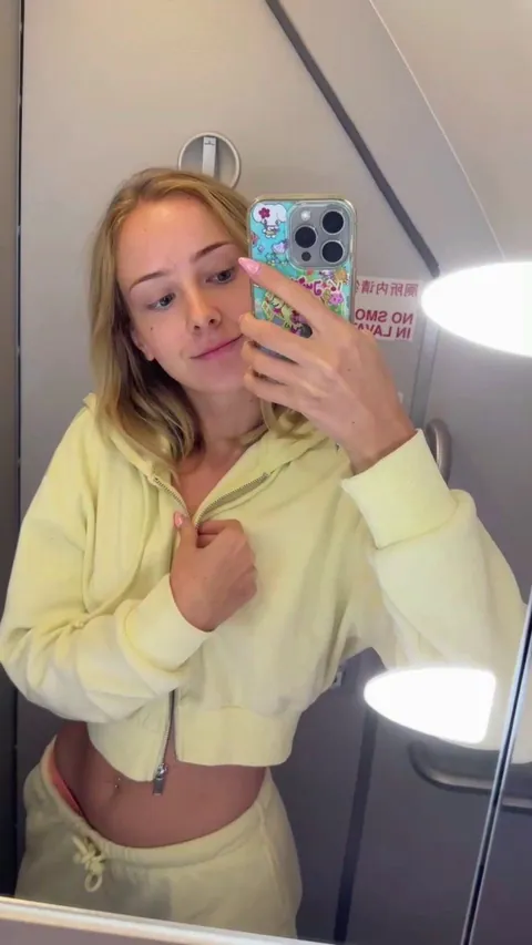 Flashing my tits in the airplane bathroom knowing someone was right outside… it turned me on even more