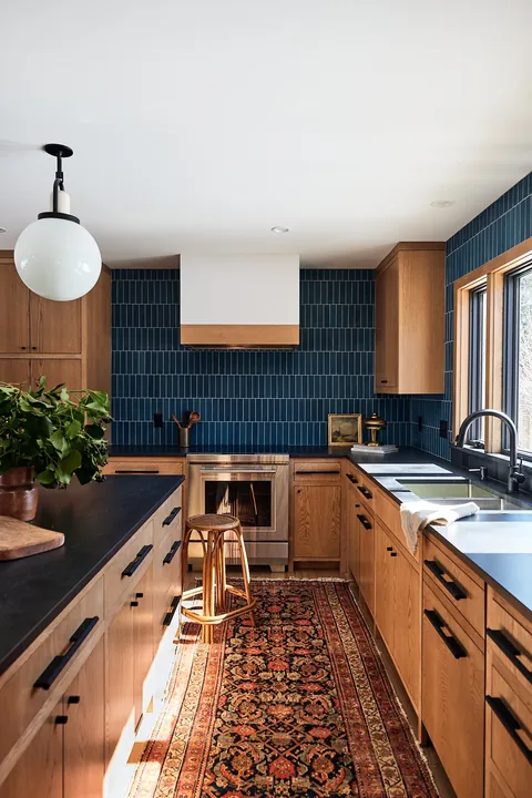 Blue tiled backsplash kitchen in a renovated suburban home, Minnesota [1334x2000]