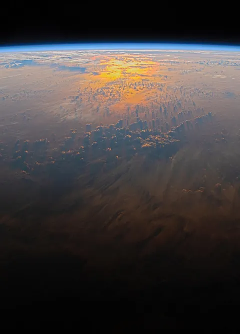 Sun setting over the Pacific Ocean, photo from the ISS.