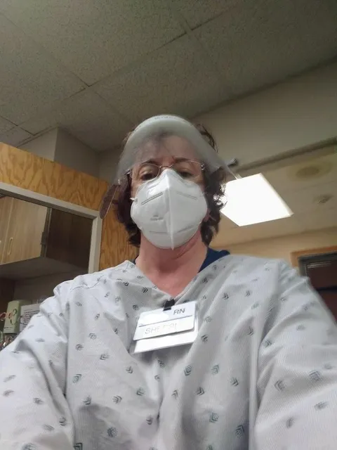This is my mom. She's been working up to 16-20 hours a day at a nursing home in full PPE because someone broke the rules and introduced COVID to the residents. She may not be the best at selfies, but I'm damn proud of her.
