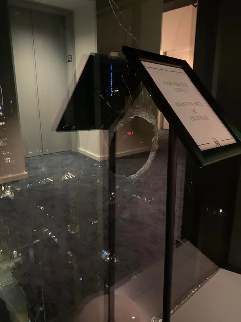 What can this giant hole on the 31st floor of my apartment building be? Woke up to a HUGE hole on the exterior window, there's no building in front of us and the terrace is on 12th floor. WTF is this???